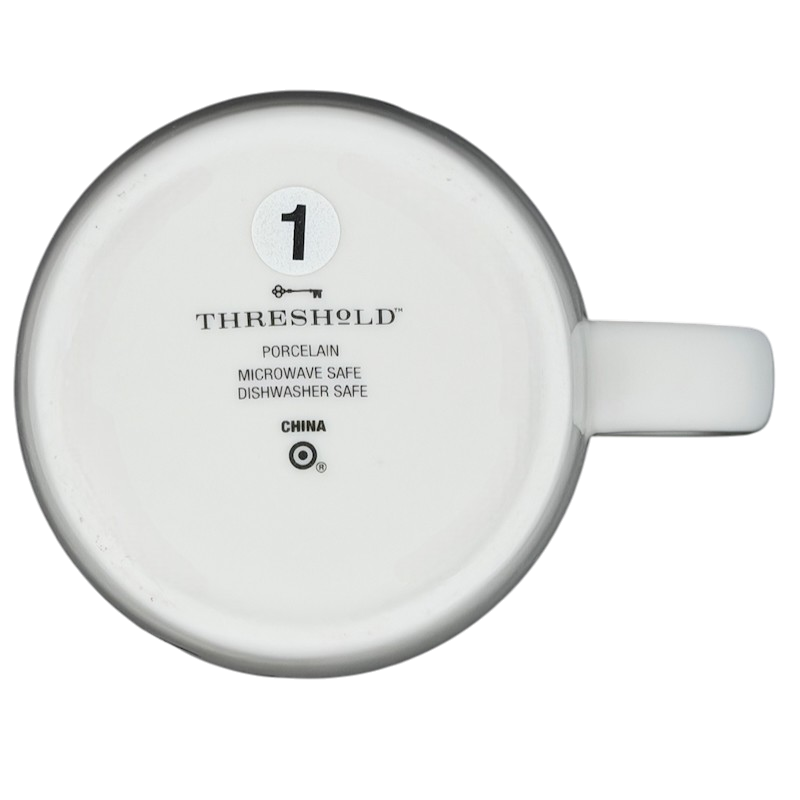 Bottom view of a Threshold PISCES Astrology Zodiac Mug showing porcelain material and care instructions