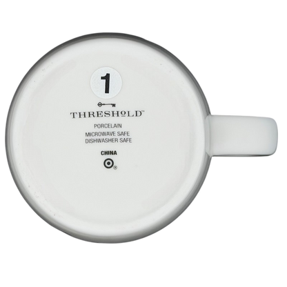 Bottom view of a Threshold PISCES Astrology Zodiac Mug showing porcelain material and care instructions