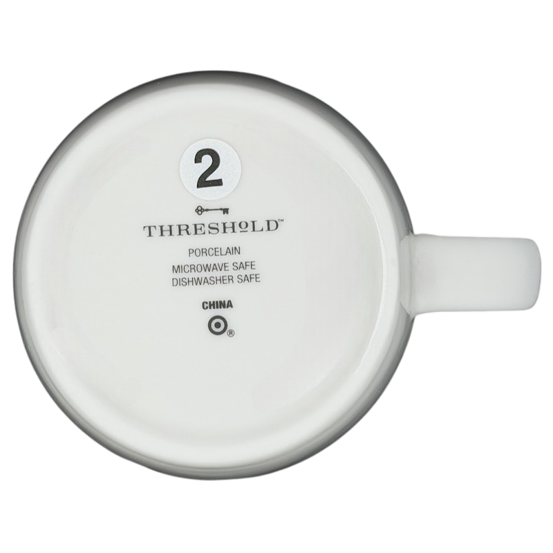 Bottom view of a Threshold PISCES Astrology Zodiac Mug featuring dishwasher and microwave safety instructions