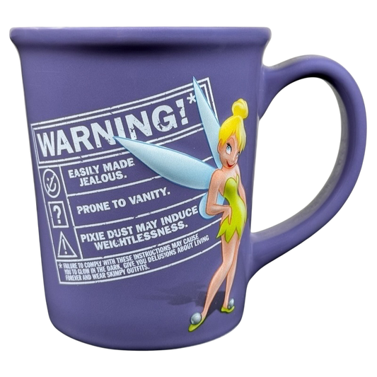 Tinker Bell embossed vintage mug featuring a playful warning label and colorful design