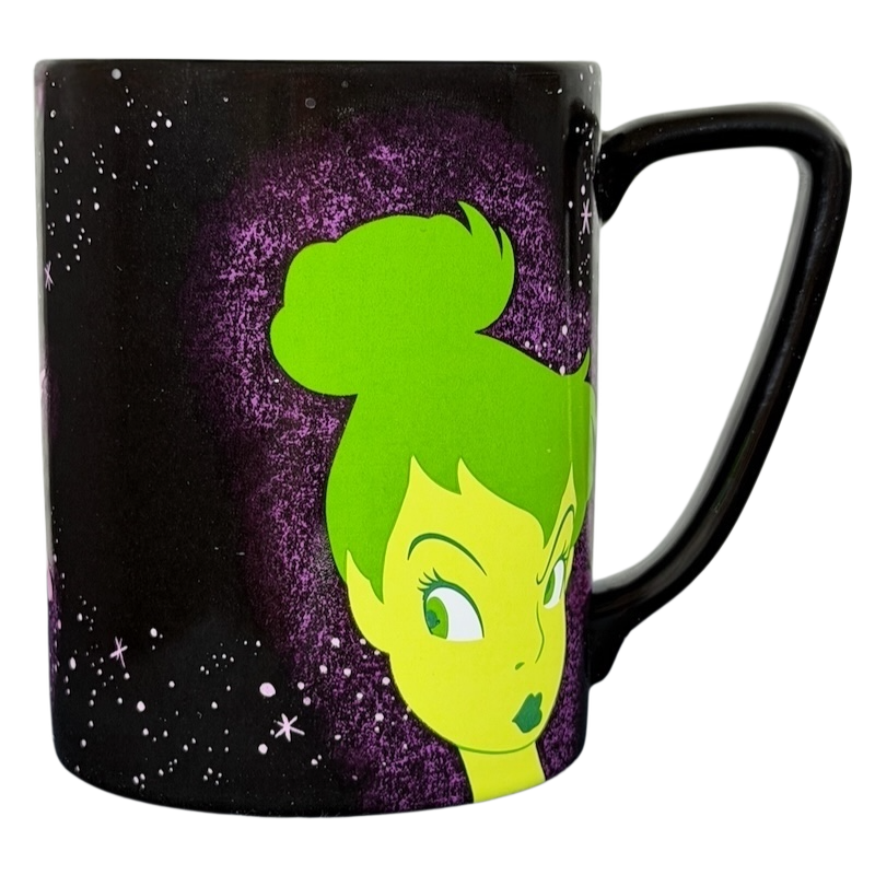 Disney Tinker Bell Pixie Dust mug featuring a vibrant green design against a cosmic background