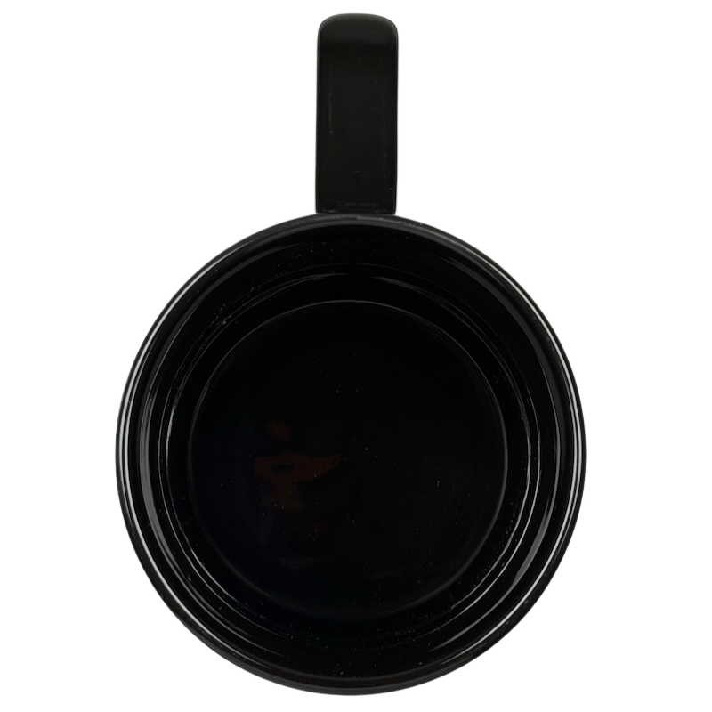 Top view of a black Tinker Bell Pixie Dust mug with a glossy finish for fairy tale fans