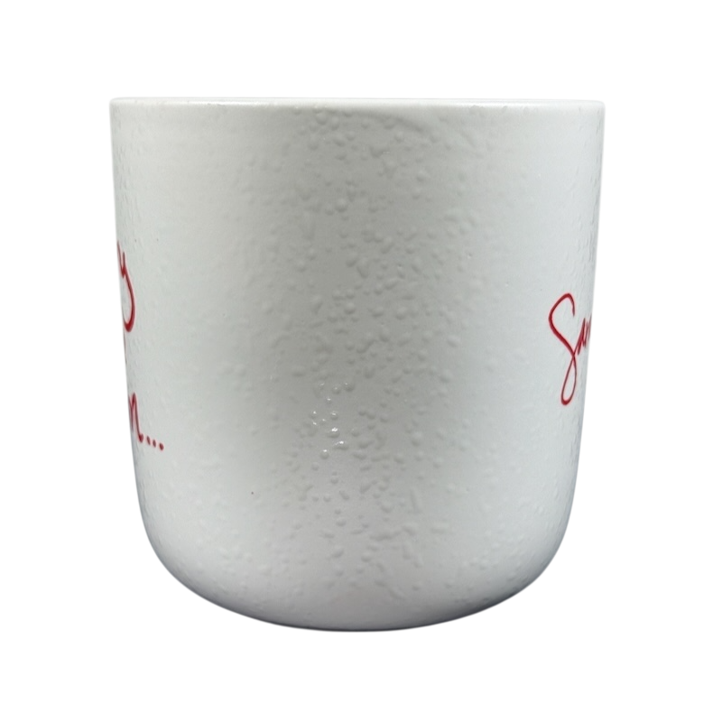 White textured ceramic Sara Bareilles tour mug with red script design ideal for coffee or tea