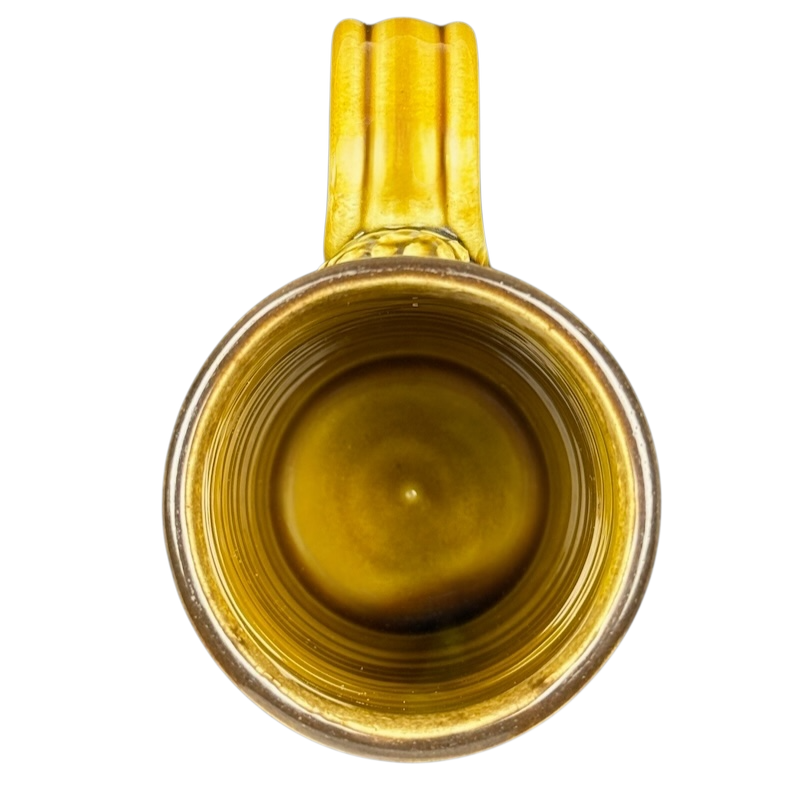 Top view of Tom's Pots Alaskan Brewing Co vintage mug featuring a unique yellow interior