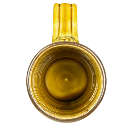 Top view of Tom's Pots Alaskan Brewing Co vintage mug featuring a unique yellow interior