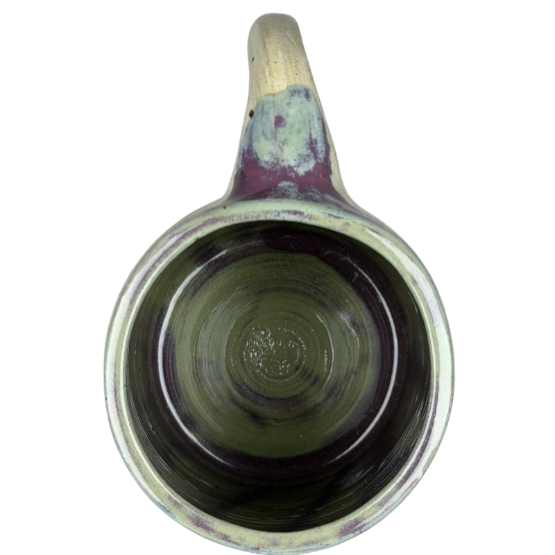 Inside view of a Duck Yeah! Tooth Hurty Pottery Mug featuring a unique glaze design