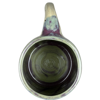 Inside view of a Duck Yeah! Tooth Hurty Pottery Mug featuring a unique glaze design