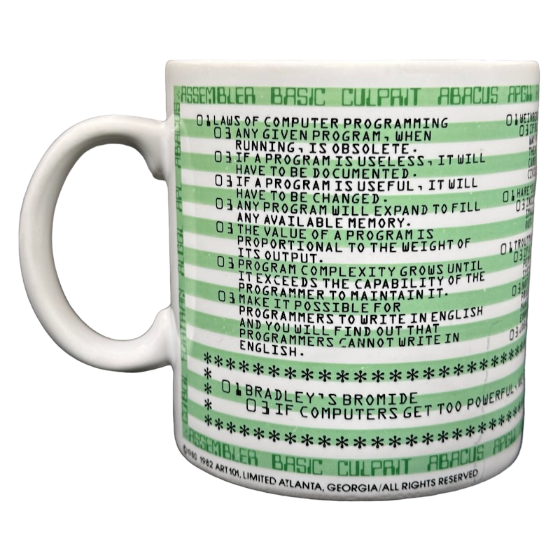 White ceramic mug with green retro code lines and printed laws of programming text Kenneth Grooms computer programming vintage mug
