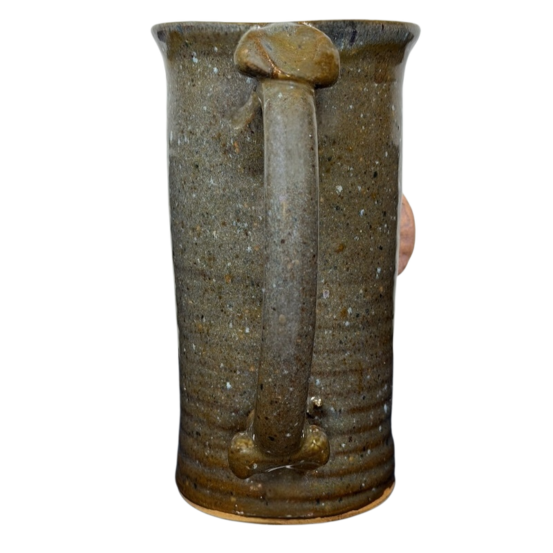 Unique ugly face pottery golf mug with a textured finish and sturdy handle