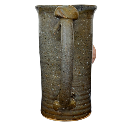 Unique ugly face pottery golf mug with a textured finish and sturdy handle