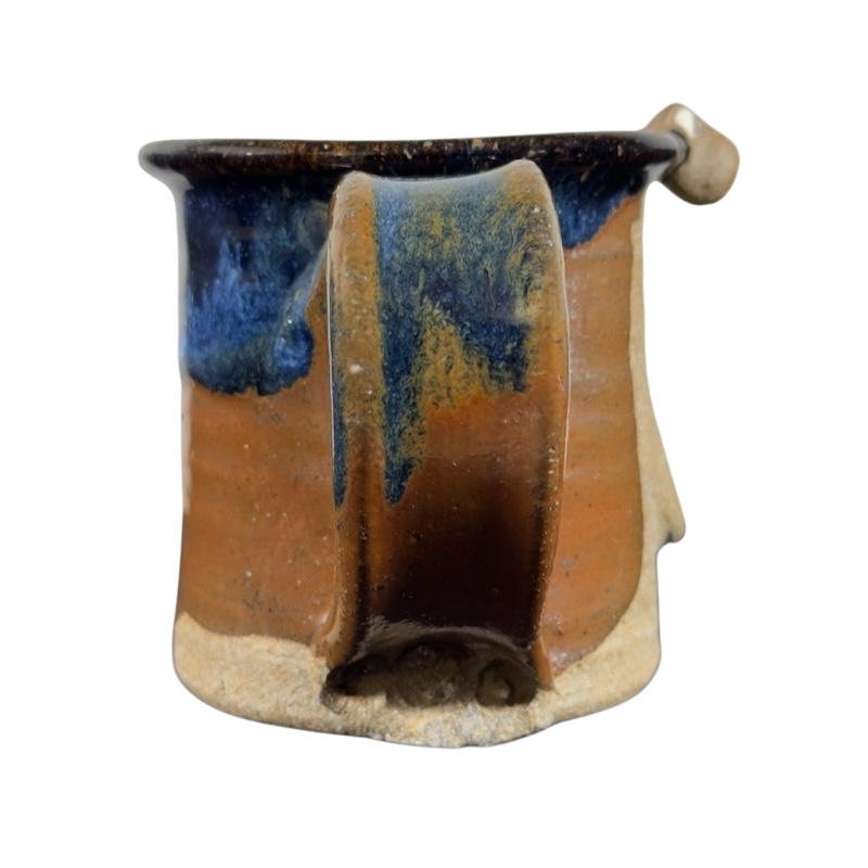 Ugly face pottery vintage winking mug with unique brown and blue glaze and artistic handle design
