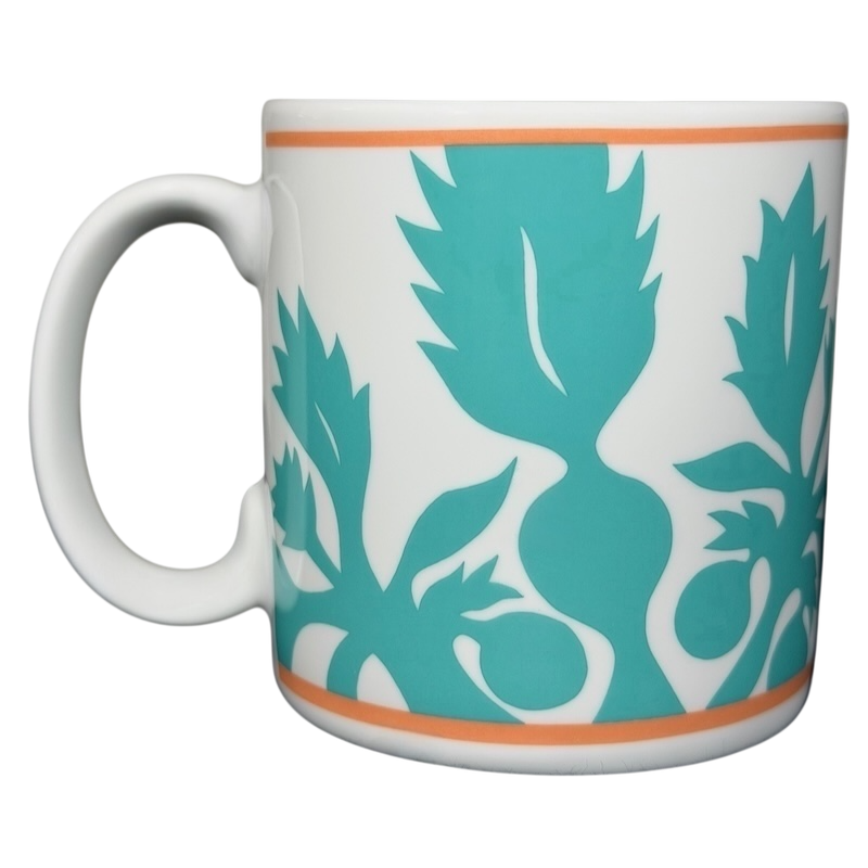 ULU Mamo turquoise floral vintage mug with bold plant designs and an orange accent band
