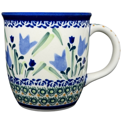 Unikat Boleslawiec blue bell floral mug featuring vibrant floral designs and a decorative border