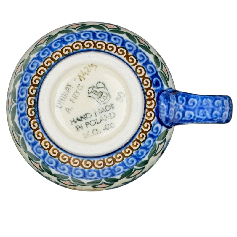 Unikat Boleslawiec Blue Floral mug featuring intricate hand-painted designs and a comfortable handle
