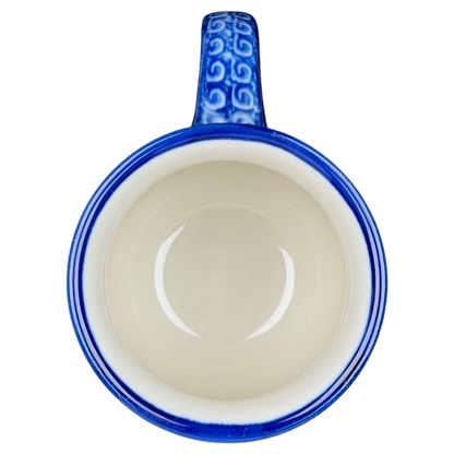 Unikat Boleslawiec Blue Floral mug with an intricate blue handle and smooth cream interior