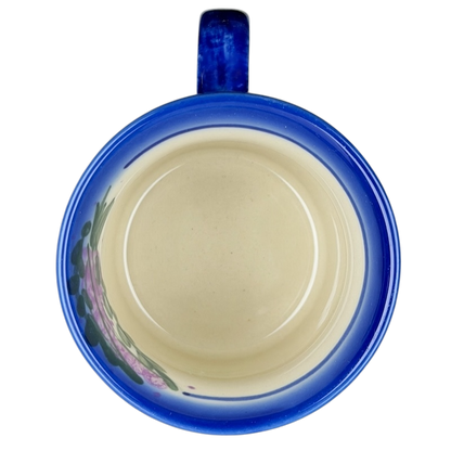 Inside view of Unikat Polish Pottery ANDY Boleslawiec Floral Mug with a blue rim and floral decoration