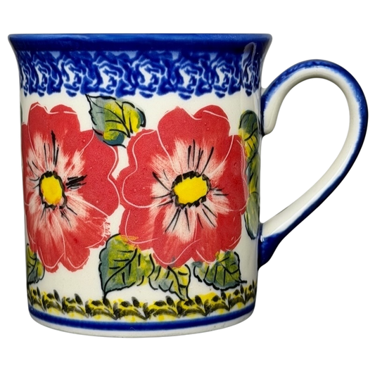 Unikat Polish Pottery Boleslawiec Kalich Floral Mug featuring vibrant red flowers and blue trim