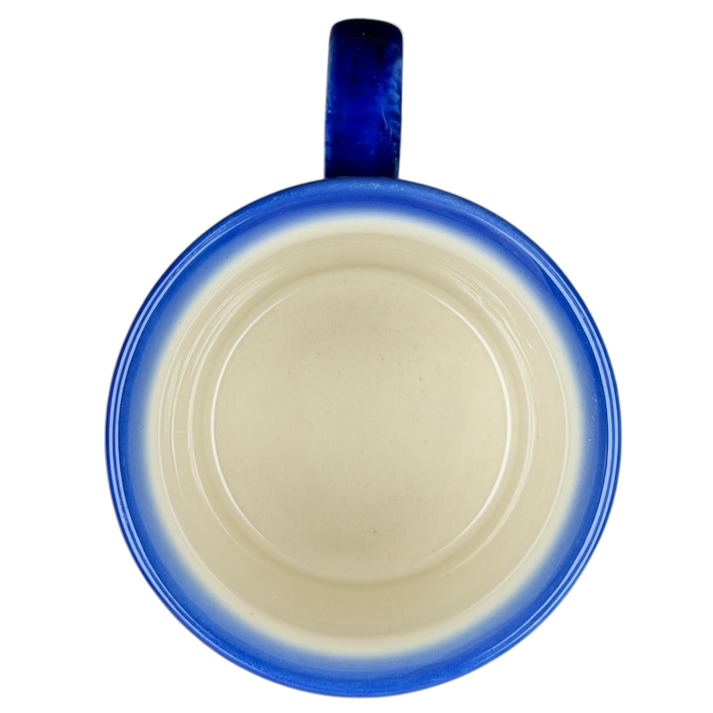 Unikat Polish Pottery Boleslawiec Kalich Floral Mug with a blue rim and smooth interior design