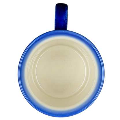 Unikat Polish Pottery Boleslawiec Kalich Floral Mug with a blue rim and smooth interior design