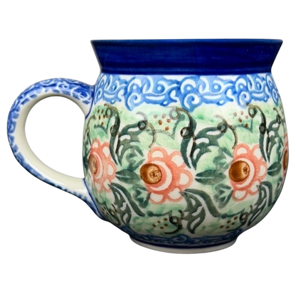 Unikat Polish pottery Boleslawiec mug featuring intricate floral designs in vibrant colors