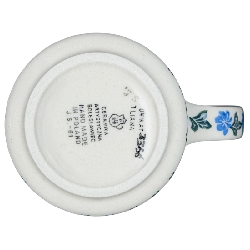 Base view of Unikat Polish pottery hummingbird mug with floral design and artisanal markings
