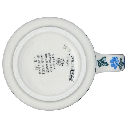 Base view of Unikat Polish pottery hummingbird mug with floral design and artisanal markings