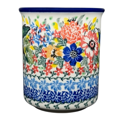 Colorful Unikat Polish pottery hummingbird mug adorned with floral patterns and intricate designs