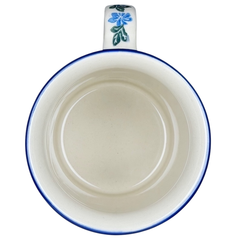 Inside view of Unikat Polish pottery hummingbird mug with floral design and blue trim