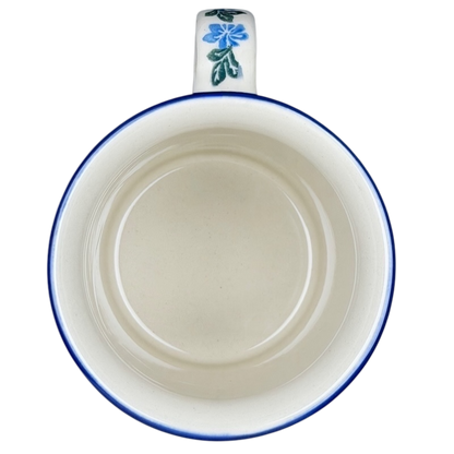 Inside view of Unikat Polish pottery hummingbird mug with floral design and blue trim