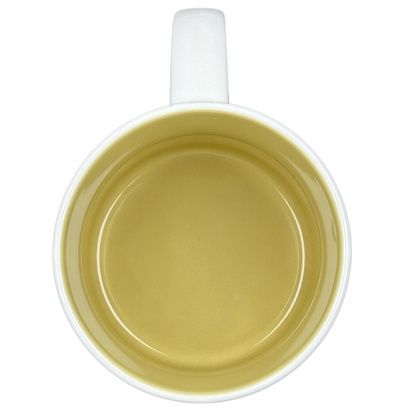 Inside view of a white ceramic University of Washington Starbucks mug with a smooth yellow interior