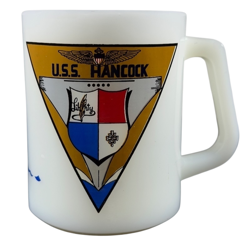 USS Hancock vintage Fire King mug featuring a military insignia design in vibrant colors