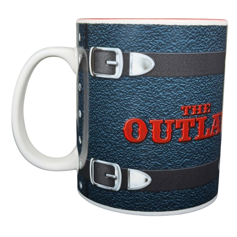 The Outlaw 1941 collectible mug featuring a textured design with a bold red logo