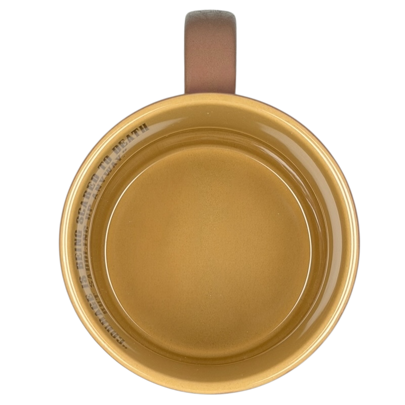 Top view of John Wayne Courage Is Being Scared To Death Mug Vandor in classic yellow with a sturdy handle