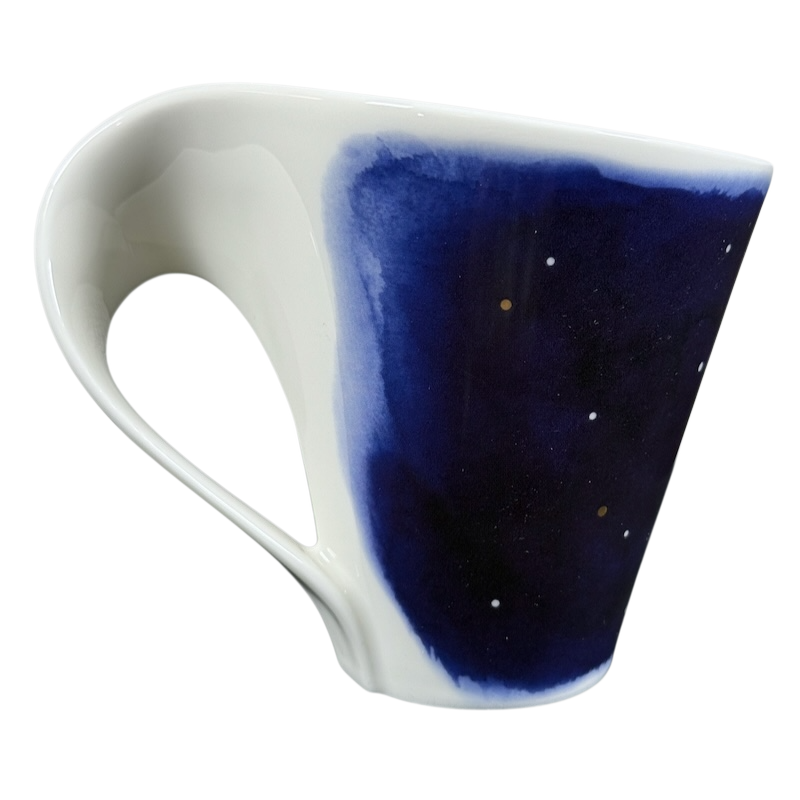 Villeroy and Boch New Wave Stars Sagittarius zodiac coffee mug. White porcelain cup with blue star panel and ergonomic handle