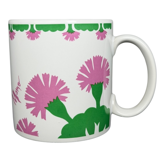 Vintage Aloha Airlines Mamo mug featuring colorful floral designs and a vibrant green trim