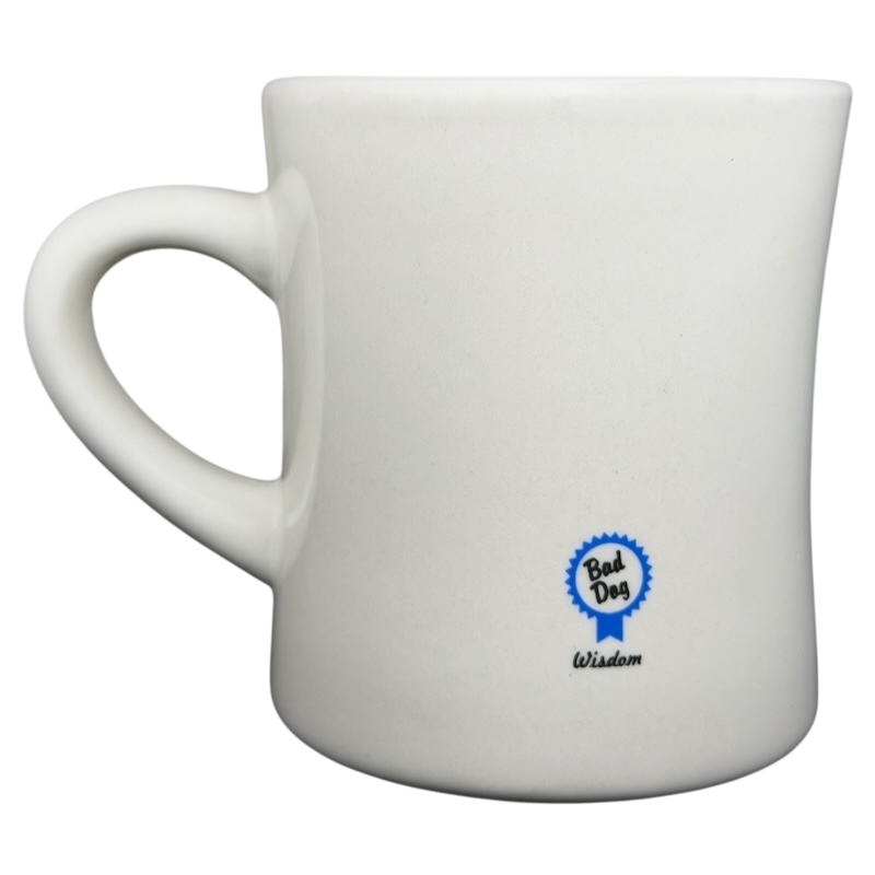 Vintage Bad Dog Wisdom Assert Yourself mug featuring a blue badge logo on a white background