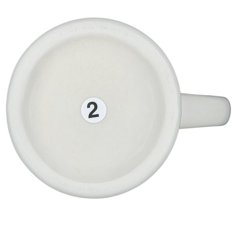Bottom view of vintage Bad Dog Wisdom Assert Yourself mug showing the number 2 stamped on it