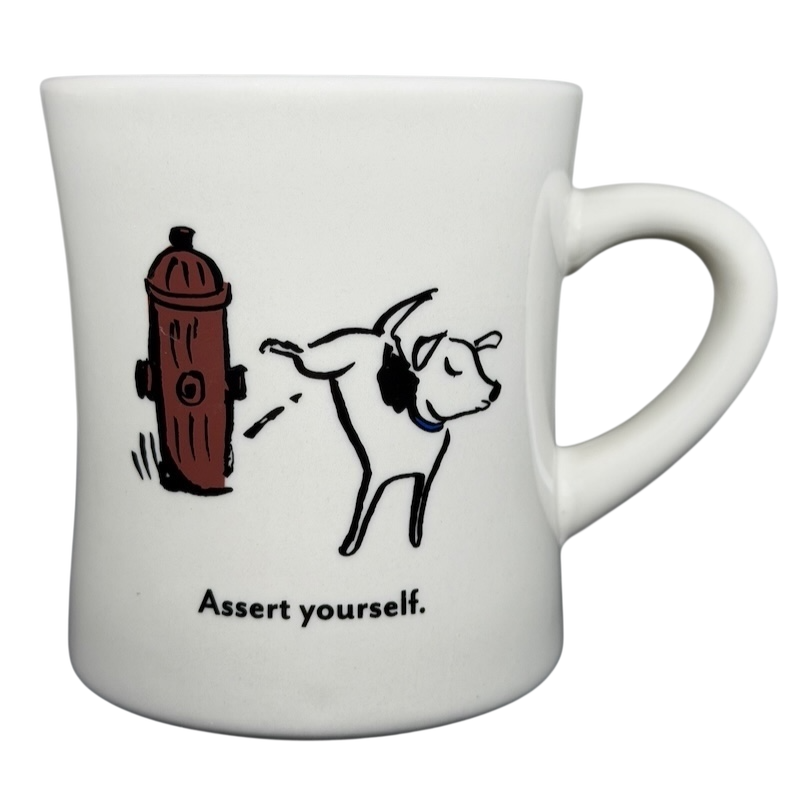 Vintage Bad Dog Wisdom Assert Yourself mug featuring a playful dog and hydrant illustration