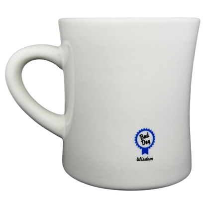 Vintage Bad Dog Wisdom Assert Yourself mug in white ceramic with a blue logo