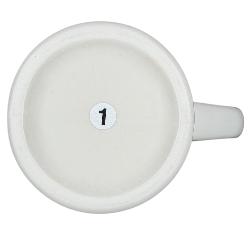 Bottom view of a vintage Bad Dog Wisdom Defy Authority mug showing a numbered base