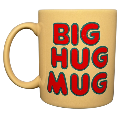 Bright yellow vintage Big Hug Mug featuring bold red lettering for a fun coffee experience
