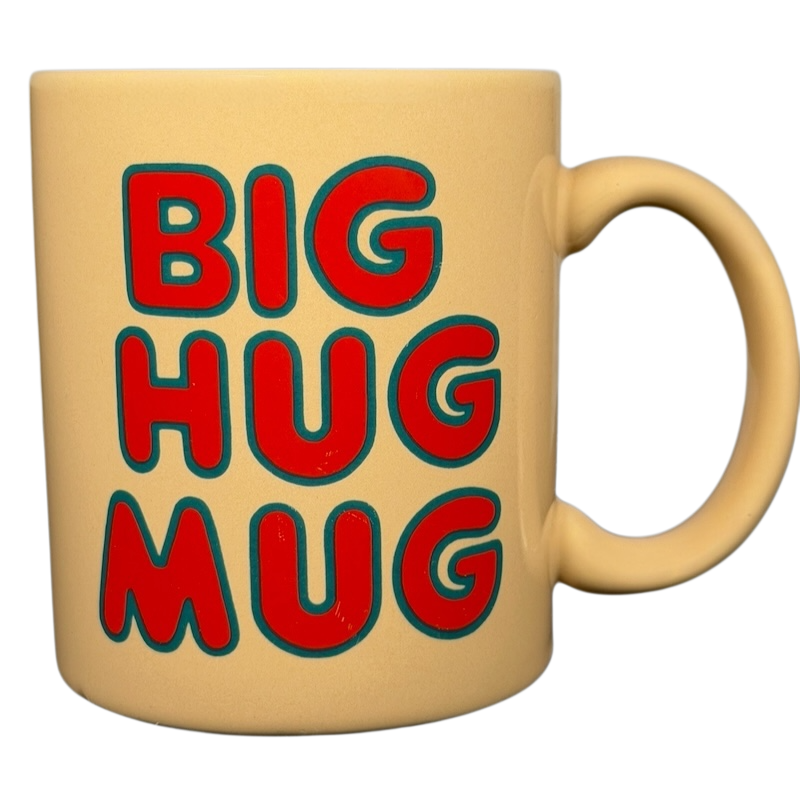 Vintage Big Hug Mug in yellow with bold red and blue lettering for a fun coffee experience
