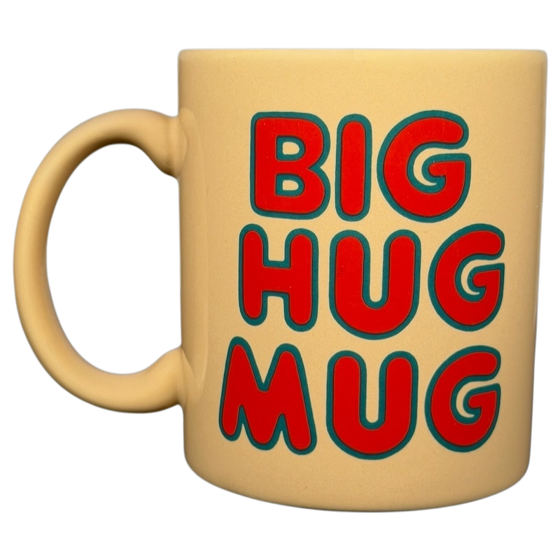 Vintage Big Hug Mug in beige with bold colorful text for a cheerful coffee experience
