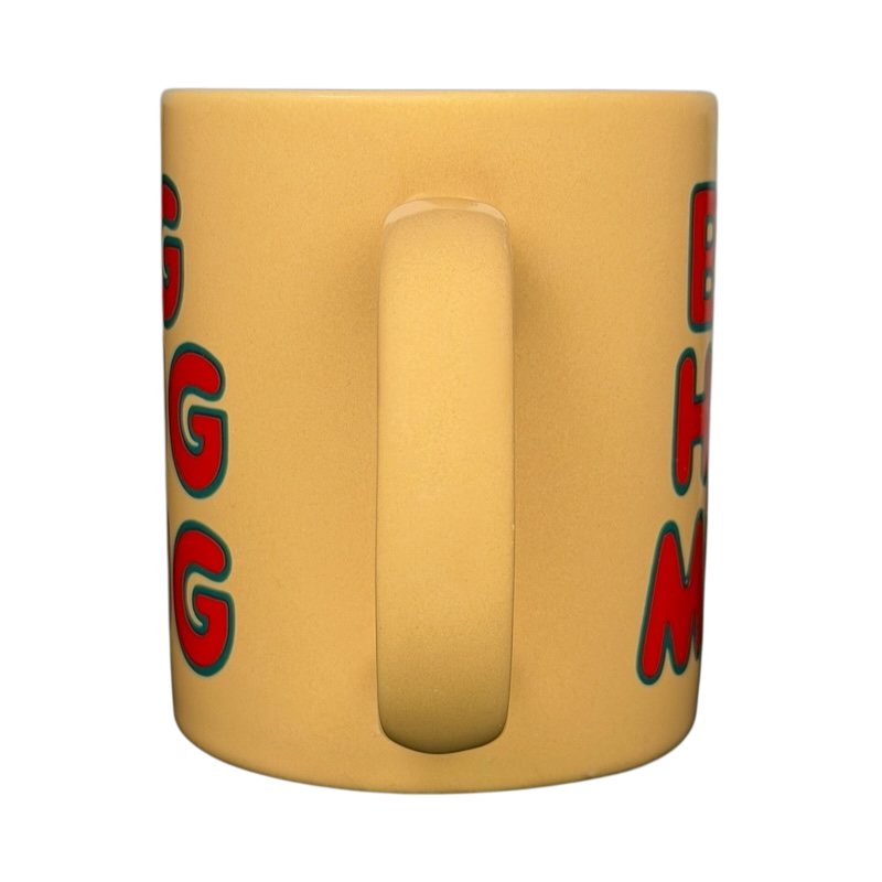 Front view of vintage Big Hug Mug in yellow with red and blue lettering for cozy beverages
