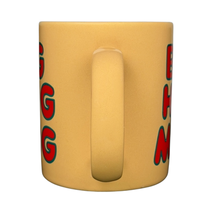 Front view of vintage Big Hug Mug in yellow with red and blue lettering for cozy beverages