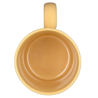 Top view of a vintage Big Hug Mug in a warm yellow color for cozy beverages
