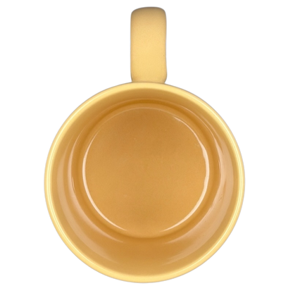 Top view of a vintage Big Hug Mug in yellow, showcasing its smooth interior and comfortable handle