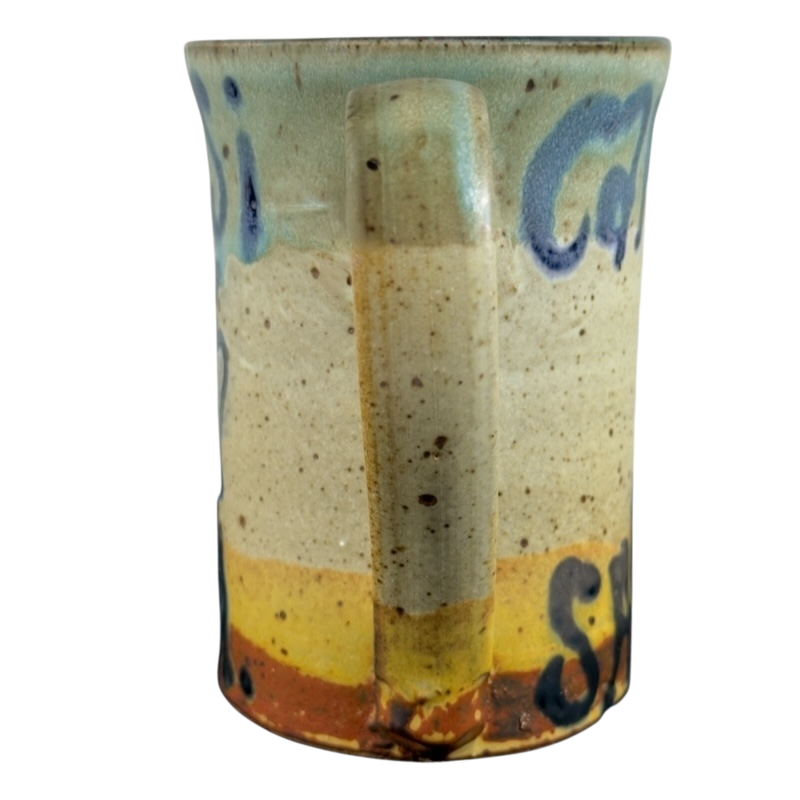 Vintage Caffe Pergolesi mug with speckled glaze and blue hand-painted lettering