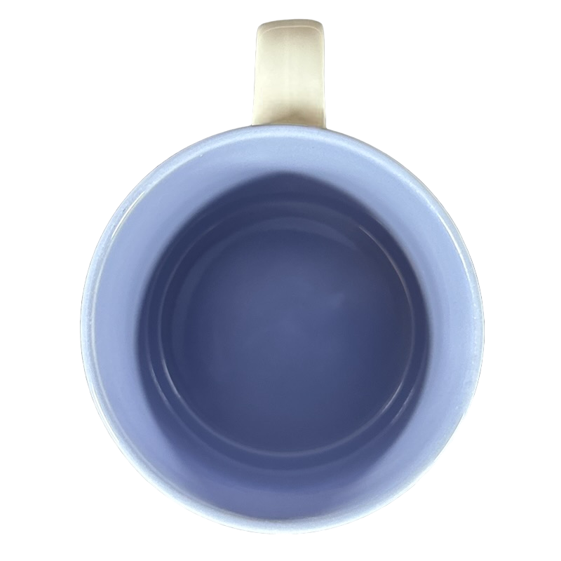 View from above of a vintage collectible PATRICIA name mug in soft blue with a smooth interior