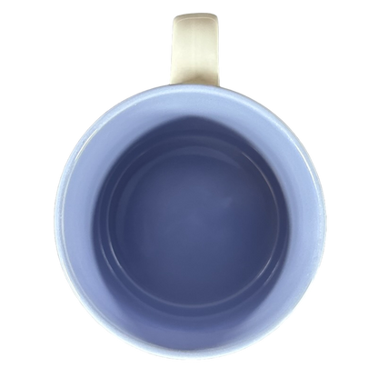 View from above of a vintage collectible PATRICIA name mug in soft blue with a smooth interior